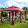 A red gazebo set up in a backyard with a table and chairs, and a grill nearby. Anteprima dell’immagine prodotto