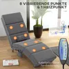 A gray massage recliner chair is shown in a room with a plant and a window. There are glowing circles on the chair indicating massage points. A remote control is also visible. Produktbild-Vorschau