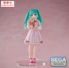 A figure of Hatsune Miku holding a teddy bear, displayed against a pink background. Produktbild-Vorschau