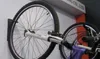 Two bicycle wheels mounted on a wall. Náhľad obrázku produktu