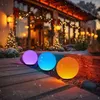 Outdoor Christmas decoration with illuminated spheres in front of a house. Anteprima dell’immagine prodotto