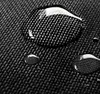 A close-up of a black textured surface with water droplets on it. Podgląd zdjęcia produktu