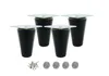 Four black furniture legs with silver mounting plates are arranged on a white background, along with screws and felt pads. Produktbild-Vorschau