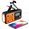 A portable emergency radio with a crank, power bank, and flashlight is shown charging a smartphone. Náhled obrázku produktu