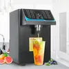 A fructose quantitative machine dispensing syrup into a cup of fruit tea, with grapefruits and blueberries in the foreground. Náhled obrázku produktu