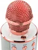 A close-up shot of a pink and rose gold karaoke microphone. Podgląd zdjęcia produktu
