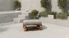 An outdoor lounge area with a modern concrete pool and a pallet-made ottoman. Produktbild-Vorschau