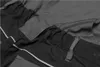 A close-up view of the fabric and stitching details of a pair of work pants. Produktbild-Vorschau