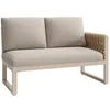 A studio shot of an outdoor sofa with beige cushions and a woven armrest. Voir les images du produit