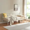 A white metal daybed with bedding and a pillow in a room with a window. Podgląd zdjęcia produktu