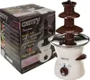 A chocolate fountain and its packaging are shown. Podgląd zdjęcia produktu