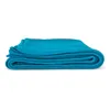A folded teal yoga blanket. Produktbild-Vorschau