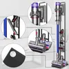 A collage of close-up shots and a main image of a Dyson vacuum cleaner and its accessories displayed on a stand. Produktbild-Vorschau