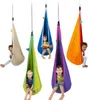 Five children are sitting in colorful hanging pod chairs. Produktbild-Vorschau
