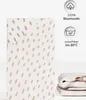 A folded fitted sheet with a dotted pattern is shown next to icons indicating material and washing instructions. Produktbild-Vorschau