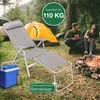 A camping scene with a chair, tent, campfire, and people. Produktbild-Vorschau