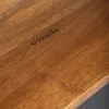 A close-up shot of a wooden surface with a logo and text engraved on it. Produktbild-Vorschau