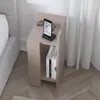 A modern nightstand next to a bed, with a phone and glasses on top and books on the shelf. Podgląd zdjęcia produktu