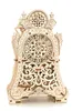 A wooden mechanical clock model on a white background. Voir les images du produit