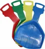 Four colorful plastic shovels with cartoon faces on the handles are arranged in a pile. Voir les images du produit