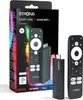 A product box and its contents, including a TV stick and remote control, are displayed against a black and white background. Náhled obrázku produktu