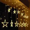 A string of star-shaped lights hanging in front of a dark background. Anteprima dell’immagine prodotto