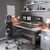 A modern home office setup with a desk, chair, computer, and shelves. Náhled obrázku produktu