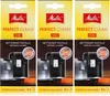 A collage of three Melitta Perfect Clean espresso machine cleaning tab packages. Produktbild-Vorschau