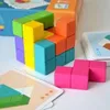 A close-up shot of a colorful wooden block puzzle and its instruction cards. Podgląd zdjęcia produktu