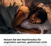 A person sleeping in bed with a blanket. Produktbild-Vorschau