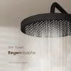 A close-up shot of a black rain shower head with water flowing out, against a light beige background. Produktbild-Vorschau