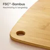 A close-up view of a bamboo cutting board with text overlay. Anteprima dell’immagine prodotto