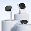 Multiple charging stations and cases for wireless earbuds are displayed on white pedestals against a light blue background. Anteprima dell’immagine prodotto
