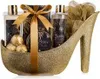 A gift set for women presented in a golden high-heeled shoe. Produktbild-Vorschau