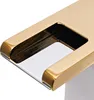 A close-up view of a golden faucet with a waterfall spout. Podgląd zdjęcia produktu