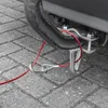 Close-up of a red safety cable attached to a trailer hitch. Produktbild-Vorschau