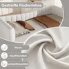 A close-up view of a white upholstered bed with pillows and a brown blanket, with a fabric texture detail in the foreground. Anteprima dell’immagine prodotto