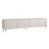 A long, low cabinet with four doors and gold legs, presented against a white background. Náhled obrázku produktu