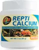 A white plastic container of reptile calcium supplement. Voir les images du produit