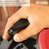 A close-up shot of a hand holding a black ergonomic handle of a tool, with a red component visible on the right. Text overlay describes the handle's features. Produktbild-Vorschau
