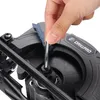 A close-up shot of a hand using a hex wrench to adjust a part of a black power tool, likely a circular saw. Produktbild-Vorschau