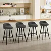 A kitchen counter with bar stools and decorative items. Náhľad obrázku produktu