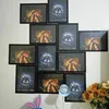 A collage of framed pictures of a character in a red outfit, with some pictures featuring a blue or orange background. Anteprima dell’immagine prodotto