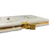 A close-up side view of a plush, lockable notebook with a gold lock and clasp. Produktbild-Vorschau