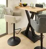 Two bar stools are shown next to a bar table in a room with a window. Produktbild-Vorschau