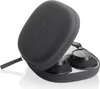 A pair of black over-ear headphones are partially inside their black carrying case. Podgląd zdjęcia produktu
