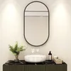 A bathroom vanity with a sink, mirror, and accessories. Podgląd zdjęcia produktu