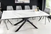 A dining table with chairs in a modern dining room setting. Produktbild-Vorschau