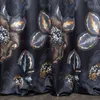 A close-up view of a dark fabric with a floral pattern. Produktbild-Vorschau