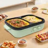 A multi-functional electric hot pot and grill with food items on a wooden table. Produktbild-Vorschau
